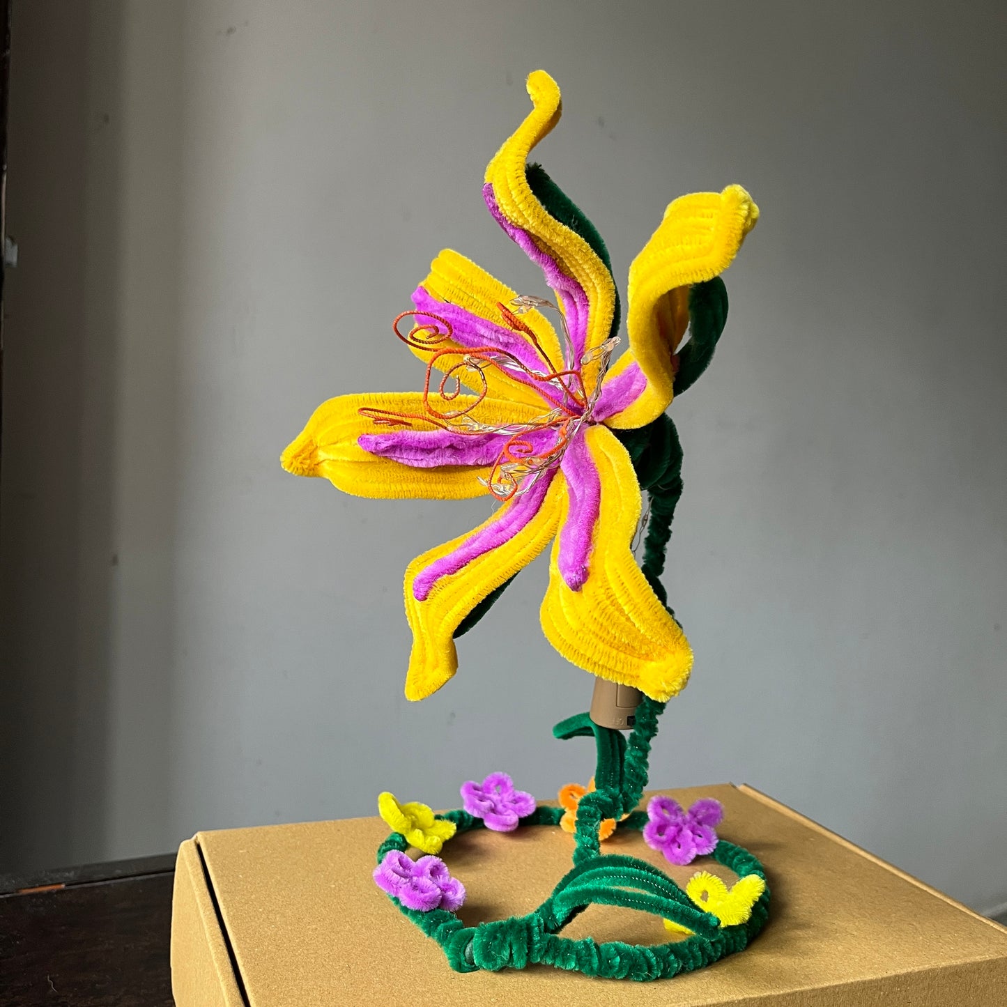 Rapunzel flower lamp made with vibrant pipe cleaners day light view, available on afzaai.in