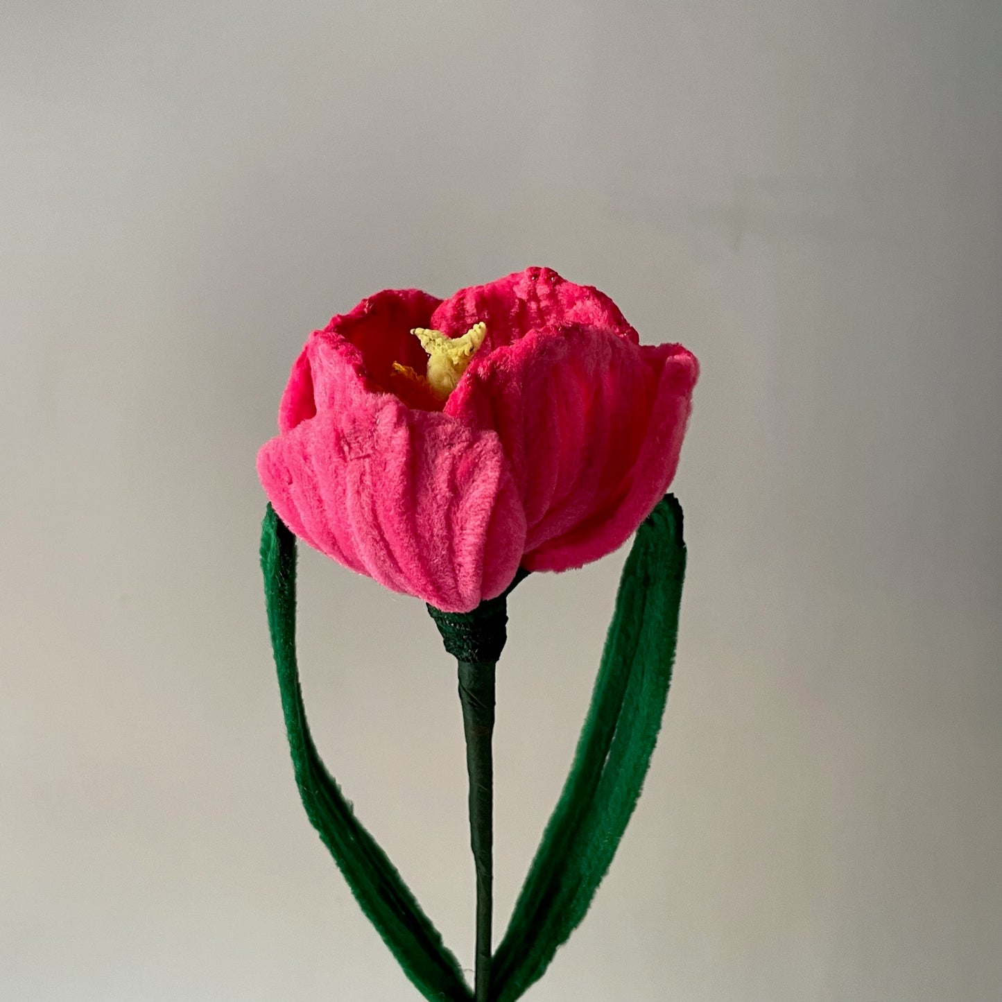 close up shot of single pink tulip made with pipe cleaners
