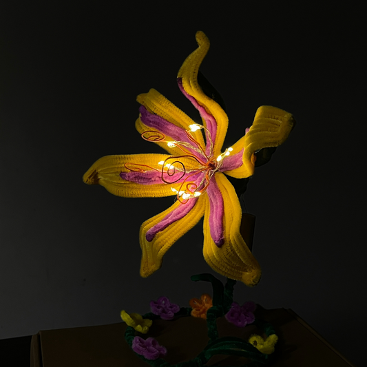 Rapunzel flower lamp made with pipe cleaners, glowing in the dark