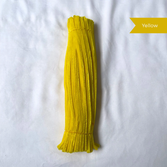 Yellow pipe cleaners on a white background with a label indicating color, available in 50 piece or 100 piece packs.